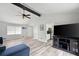 Bright living area with vaulted ceiling, grey walls, modern furniture, and hardwood floors at 2103 Blue Creek Ct, Conley, GA 30288