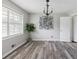 Inviting living room with large window, hardwood flooring, and neutral color palette at 2103 Blue Creek Ct, Conley, GA 30288