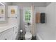 Bathroom with a white vanity, toilet, tub, and neutral walls at 2910 Edwards Ct, Marietta, GA 30068