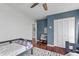 A cozy bedroom with hardwood floors, a colorful rug, and a twin bed at 2910 Edwards Ct, Marietta, GA 30068