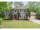 Charming two-story home with a well-manicured lawn and a vibrant red front door at 2910 Edwards Ct, Marietta, GA 30068