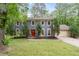 Charming two-story home with a well-manicured lawn and a vibrant red front door at 2910 Edwards Ct, Marietta, GA 30068