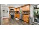 Modern kitchen featuring wood cabinetry, stainless steel appliances, and a tile backsplash at 2910 Edwards Ct, Marietta, GA 30068