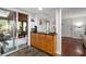 Breakfast bar with cabinets sits adjacent to the sunroom with slate tile floor at 2910 Edwards Ct, Marietta, GA 30068