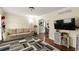 Cozy living room with hardwood floors, a comfortable sofa, and a flat-screen TV at 2910 Edwards Ct, Marietta, GA 30068