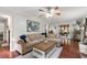 Bright living room featuring hardwood floors, a ceiling fan and views of the sunroom at 2910 Edwards Ct, Marietta, GA 30068