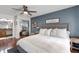 Comfortable main bedroom featuring hardwood floors and en suite bathroom with cabinet vanity at 2910 Edwards Ct, Marietta, GA 30068