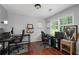 Office space with hardwood floors, two desks, chairs, and natural lighting at 2910 Edwards Ct, Marietta, GA 30068