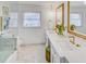 Bathroom featuring double vanity, marble floors, framed mirrors, chandelier, and a luxurious bathtub at 3519 Sunderland Ne Way, Brookhaven, GA 30319