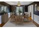 Stylish dining room with dark walls, a modern chandelier, and a round table for intimate gatherings at 3519 Sunderland Ne Way, Brookhaven, GA 30319