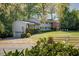 Traditional two-story home featuring a well-manicured lawn, beautiful landscaping and white picket fence at 3519 Sunderland Ne Way, Brookhaven, GA 30319