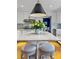 Modern kitchen with white cabinets, marble countertops, a large island, and seating at 3519 Sunderland Ne Way, Brookhaven, GA 30319