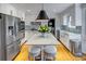 Modern kitchen featuring white cabinets, stainless steel appliances, and a marble island with seating at 3519 Sunderland Ne Way, Brookhaven, GA 30319