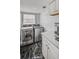 Modern laundry room features black marble floors, stainless steel washer and dryer at 3519 Sunderland Ne Way, Brookhaven, GA 30319