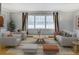 Bright living room featuring neutral furniture, large windows, and stylish decor at 3519 Sunderland Ne Way, Brookhaven, GA 30319