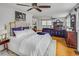 Spacious main bedroom featuring a king bed, ceiling fans, TV and a comfy lounging area at 3519 Sunderland Ne Way, Brookhaven, GA 30319