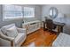 Stylish office features hardwood floors, a modern desk, and comfortable seating at 3519 Sunderland Ne Way, Brookhaven, GA 30319
