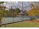 Well-maintained tennis courts enclosed by fencing with benches for spectators at 3519 Sunderland Ne Way, Brookhaven, GA 30319