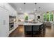 Gourmet kitchen with a large center island, stainless steel appliances, and an open layout at 12815 Oak Falls Dr, Alpharetta, GA 30009
