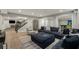 Spacious finished basement with a comfortable living area and a game room beyond at 12815 Oak Falls Dr, Alpharetta, GA 30009