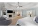 This luxurious main bedroom has fireplace, sitting area and a large bathroom and closet at 12815 Oak Falls Dr, Alpharetta, GA 30009