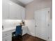 Office area boasts custom cabinets, a built-in desk, beadboard detail and hardwood floors at 12815 Oak Falls Dr, Alpharetta, GA 30009
