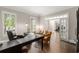 Inviting home office with neutral colors, plantation shutters, and dark wood flooring at 12815 Oak Falls Dr, Alpharetta, GA 30009