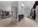 Huge walk-in closet with custom shelves, hanging racks and carpeted floors at 12815 Oak Falls Dr, Alpharetta, GA 30009