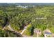 Overhead view of 1488 Campbell Rd near Jackson Lake, encircled by dense foliage and roads at 1488 Campbell Rd, Covington, GA 30014