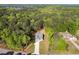 Aerial view of home surrounded by beautiful mature trees and natural landscape at 1488 Campbell Rd, Covington, GA 30014