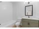 Bathroom featuring tub, shower, and updated vanity with new fixtures at 1488 Campbell Rd, Covington, GA 30014