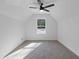Bedroom with neutral carpet, white walls, ceiling fan and a window with natural light at 1488 Campbell Rd, Covington, GA 30014
