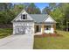 Charming new construction home with a well-manicured lawn and inviting front entrance at 1488 Campbell Rd, Covington, GA 30014
