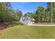 Expansive lawn surrounds this beautiful, newly constructed home nestled in a wooded landscape at 1488 Campbell Rd, Covington, GA 30014