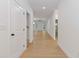 Bright hallway with modern lighting, leading to an open-concept living space at 1488 Campbell Rd, Covington, GA 30014