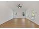 Bright living room featuring hardwood floors, ceiling fan, white trim, and lots of natural light at 1488 Campbell Rd, Covington, GA 30014