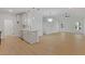 Open-concept kitchen and living room area with hardwood floors and modern lighting fixtures at 1488 Campbell Rd, Covington, GA 30014