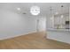 Bright living room showcasing hardwood floors, recessed lights, and a view into the kitchen at 1488 Campbell Rd, Covington, GA 30014