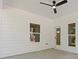 Covered patio features a ceiling fan and lots of natural light at 1488 Campbell Rd, Covington, GA 30014