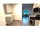 Modern kitchen boasts white cabinets, stainless steel appliances, and granite countertops at 710 Park Place Trl, Social Circle, GA 30025