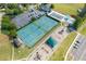 Aerial view of neighborhood amenities, featuring tennis courts, a pool, and a playground at 1593 Brynwood Nw Ct, Acworth, GA 30101