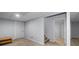 Finished basement area with carpet flooring, access door, and an open floor plan at 1593 Brynwood Nw Ct, Acworth, GA 30101