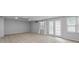 The spacious basement features carpet, natural light, and double doors to the backyard at 1593 Brynwood Nw Ct, Acworth, GA 30101