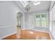 Bright breakfast nook featuring skylights, chandelier, hardwood floors, and natural light at 1593 Brynwood Nw Ct, Acworth, GA 30101