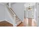 Bright foyer with hardwood floors, staircase, and chandelier. The open layout leads to other rooms at 1593 Brynwood Nw Ct, Acworth, GA 30101