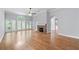 Spacious living room with hardwood floors, stone fireplace, and abundant natural light from the large windows at 1593 Brynwood Nw Ct, Acworth, GA 30101