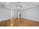 Spacious main bedroom featuring trey ceilings, ceiling fan, hardwood floors, and neutral paint at 1593 Brynwood Nw Ct, Acworth, GA 30101