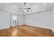 Large main bedroom with trey ceiling, ceiling fan, hardwood floors, and ample natural light at 1593 Brynwood Nw Ct, Acworth, GA 30101
