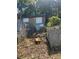 Backyard features concrete walls, storage space, and natural foliage, offering space for landscaping and outdoor activities at 2066 Bethel Nw Dr, Atlanta, GA 30314