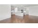 Open-concept living space featuring a modern kitchen with an island and gray cabinets at 464 Village Ln, Fairburn, GA 30213